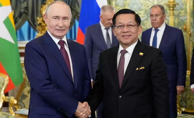 Russian President Vladimir Putin, left, and Myanmar President Min Aung Hlaing pose for photos during their meeting at the Grand Kremlin Palace, in Moscow, Tuesday, Aug. 18, 2026. (AP Photo/Alexander Zemlianichenko, Pool)