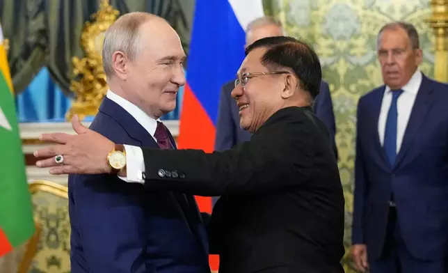 Russian President Vladimir Putin, left, welcomes Myanmar President Min Aung Hlaing during their meeting at the Grand Kremlin Palace, in Moscow, Tuesday, Aug. 18, 2026. (AP Photo/Alexander Zemlianichenko, Pool)