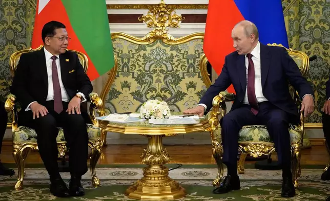 Russian President Vladimir Putin, left, and Myanmar President Min Aung Hlaing talk during their meeting at the Grand Kremlin Palace, in Moscow, Tuesday, Aug. 18, 2026. (AP Photo/Alexander Zemlianichenko, Pool)