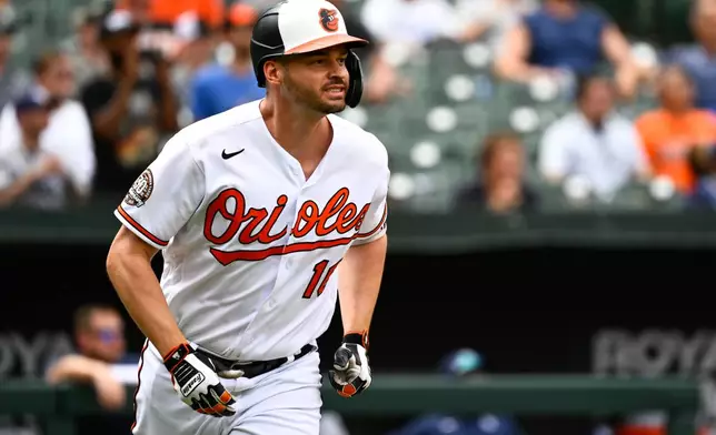 FILE - Baltimore Orioles designated hitter Trey Mancini watches his inside-the-park home run hit against Tampa Bay Rays relief pitcher Shawn Armstrong during the eighth inning of a baseball game, July 28, 2022, in Baltimore. (AP Photo/Terrance Williams, File)