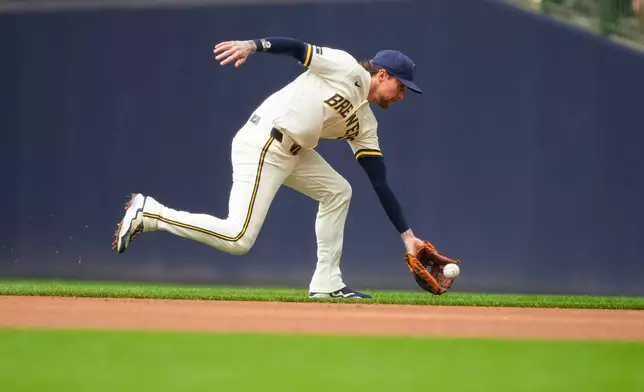 Milwaukee Brewers second baseman Brice Turang fields a ground ball hit by Pittsburgh Pirates' Jacob Gonzalez during the third inning of a baseball game Thursday, Aug. 6, 2026, in Milwaukee. (AP Photo/Kayla Wolf)