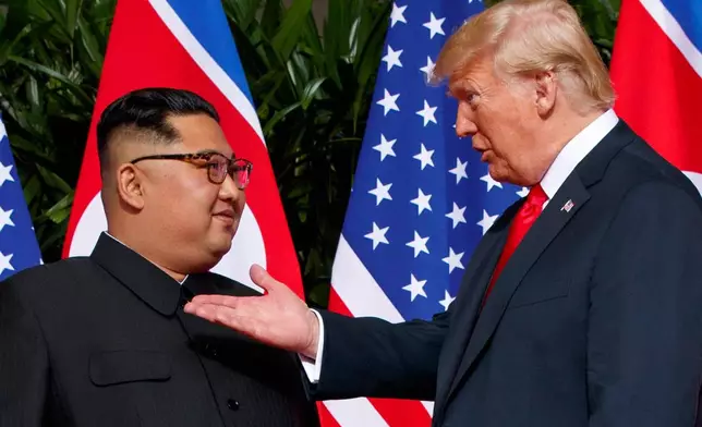 FILE - U.S. President Donald Trump, right, meets with North Korean leader Kim Jong Un on Sentosa Island in Singapore, on June 12, 2018. (AP Photo/Evan Vucci, File)