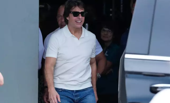 Actor Tom Crusie exits the building after attending a drivers meeting before a NASCAR auto race at Daytona International Speedway, Saturday, Aug. 29, 2026, in Daytona Beach, Fla. (AP Photo/John Raoux)