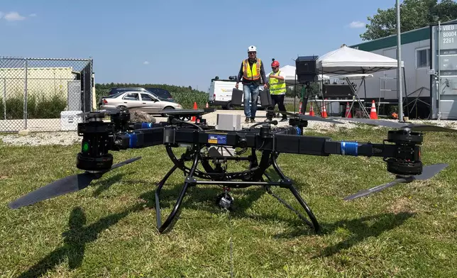 Volatus Aerospace workers prepare a heavy lift drone for testing on July 13, 2026, in Kleinburg, Ontario. (AP Photo/Kelvin Chan)