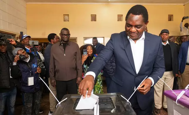 Zambia's President Hakainde Hichilema casts his vote at a polling station in Lusaka, Zambia, Thursday, Aug. 13, 2026. (AP Photo/Anita Reed)