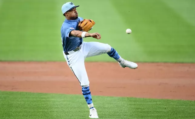 Washington Nationals second baseman Nasim Nunez throws to first base but cannot get Cincinnati Reds' Noelvi Marte during the second inning of a baseball game, Saturday, Aug. 8, 2026, in Washington. (AP Photo/Nick Wass)