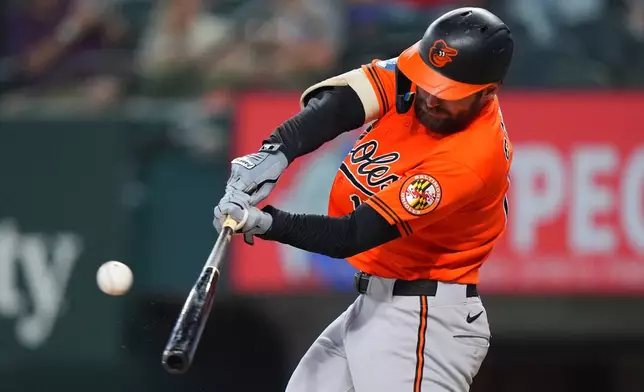 Baltimore Orioles' Colton Cowser hits a solo home run during the second inning of a baseball game against the Texas Rangers, Sunday, Aug. 9, 2026, in Arlington, Texas. (AP Photo/LM Otero)