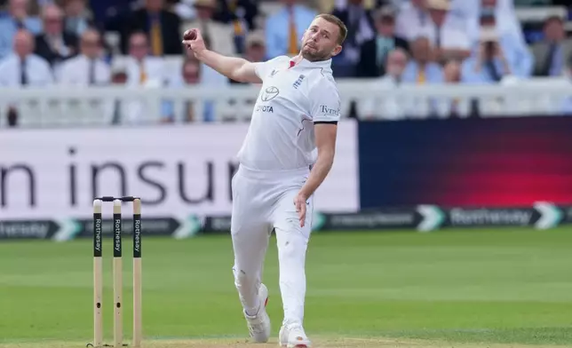 England's Gus Atkinson bowls a delivery on day two of the second cricket test match between England and Pakistan in London, Friday, Aug. 28, 2026. (AP Photo/Dave Shopland)