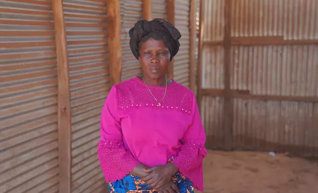 Ana Ndroy Kasime, a community health worker in Nizi, speaks during an interview as she visits homes to educate residents about Ebola and reports suspected cases to health officials in Nizi, Ituri province, eastern Congo, Friday, Aug. 14, 2026. (AP Photo/Dieudonne Dirole)