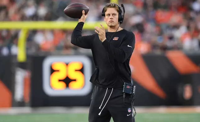 Cincinnati Bengals quarterback Joe Burrow throws during a timeout during the first half of a preseason NFL football game against the Chicago Bears on Saturday, Aug. 22, 2026, in Cincinnati. (AP Photo/Tanner Pearson)