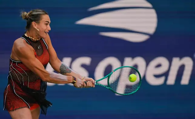 Aryna Sabalenka, of Belarus, returns the ball during a mixed doubles match at the U.S. Open tennis championships, Tuesday, Aug. 25, 2026, in New York. (AP Photo/Yuki Iwamura)