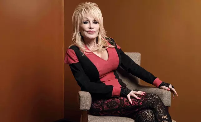 FILE - Dolly Parton poses at the Carnegie Medal of Philanthropy Ceremony in New York, on Oct. 13, 2022. (AP Photo/Andres Kudacki, File)