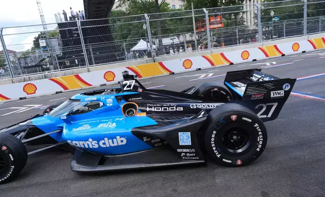 Kyle Kirkwood (27) makes a pit stop for gas during the IndyCar Freedom 250 Grand Prix auto race in Washington, Sunday, Aug. 23, 2026. (AP Photo/Alex Brandon)