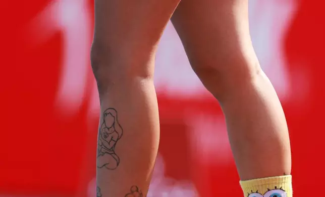 Anastasia Ntragkomirova of Greece wears SpongeBob SquarePants socks after competing in the heptathlon 100 meters hurdles at the European Athletics Championships in Birmingham, England, Friday, Aug. 14, 2026. (AP Photo/Morgan Harlow)
