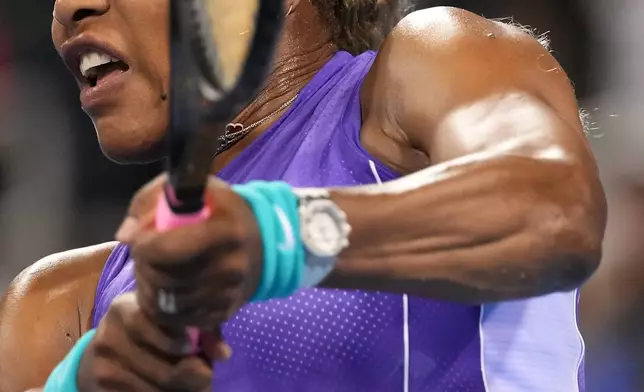 Serena Williams, of the United States, returns a shot during a women's doubles match with her sister Venus Williams against Marta Kostyuk, of Ukraine, and Peyton Stearns, also of the United States, at the Cincinnati Open tennis tournament, Monday, Aug. 17, 2026, in Mason, Ohio. (AP Photo/Kareem Elgazzar)