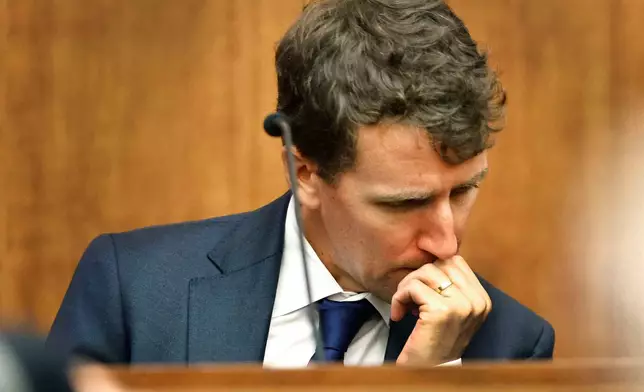 Patrick Clancy reacts as images of himself and his children on vacation a month before they were killed is shown in the courtroom at Plymouth Superior Court in Plymouth, Mass., Monday, July 27, 2026. (Greg Derr/The Patriot Ledger via AP, Pool)