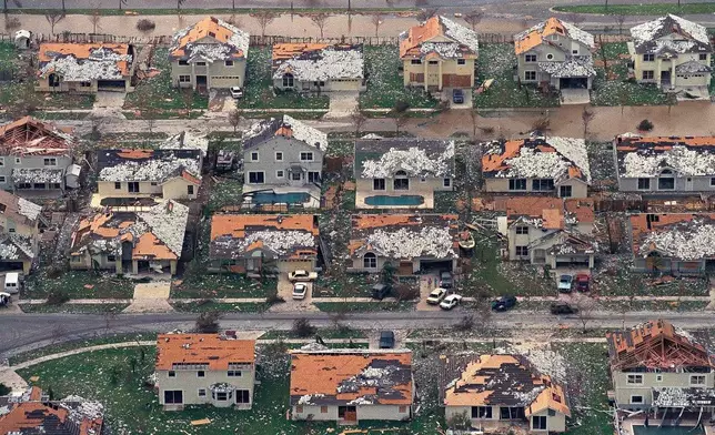 FILE - Rows of damaged houses sit between Homestead and Florida City, Fla., Aug. 25, 1992. (AP Photo/Mark Foley, File)