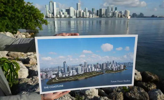 Aaron DeMayo, founder of Future Vision Studios, holds a plan for The Coastline, a regional resilience masterplan proposal to protect Southern Florida from storm surge and sea level rise Wednesday, Aug. 12, 2026, in Miami. (AP Photo/Lynne Sladky)