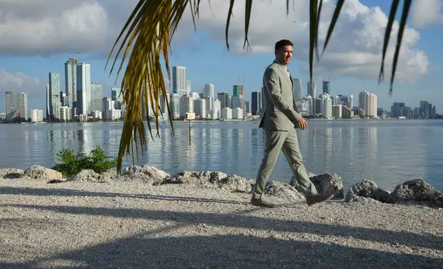 Aaron DeMayo, founder of Future Vision Studios, walks along Biscayne Bay, Wednesday, Aug. 12, 2026, in Miami. (AP Photo/Lynne Sladky)