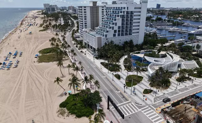 DC Alexander Park, a former parking lot that was transformed into a public space that doubles as flood infrastructure, is visible alongside the beach Wednesday, August. 7, 2026, in Fort Lauderdale, Fla. (AP Photo/Daniel Kozin)