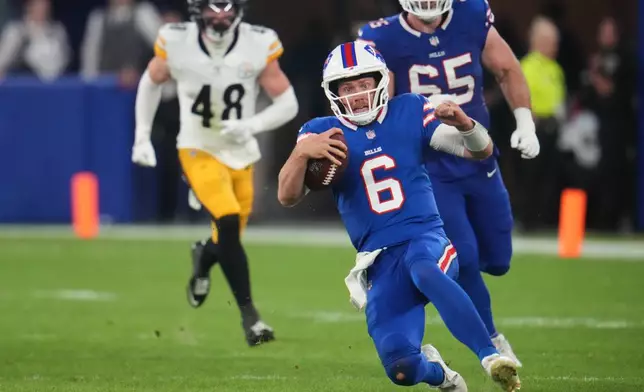 Buffalo Bills quarterback Shane Buechele (6) runs the ball for a short gain in the second half of a preseason NFL football game against the Pittsburgh Steelers in Orchard Park, NY., Thursday, Aug. 27, 2026. (AP Photo/Gene J. Puskar)