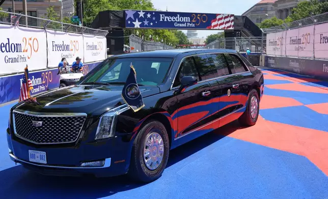 The Presidential limousine, known as The Beast, is driven along the track before Sunday's Freedom 250 Grand Prix auto race, seen Friday, Aug. 21, 2026, in Washington. (AP Photo/Alex Brandon)