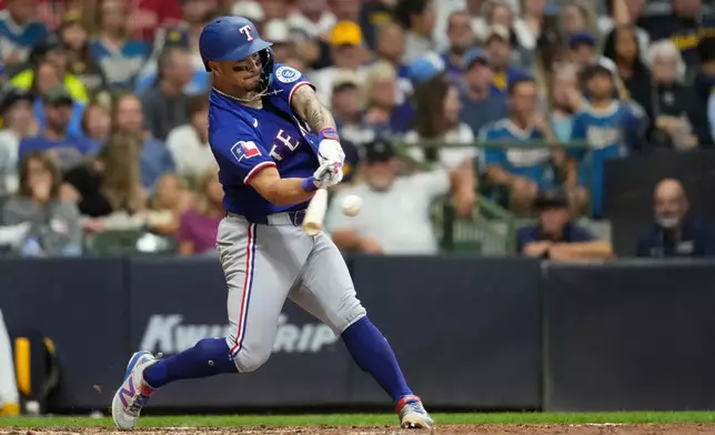 Texas Rangers' Cody Freeman hits a solo home run during the fifth inning of a baseball game against the Milwaukee Brewers, Saturday, Aug. 29, 2026, in Milwaukee. (AP Photo/Aaron Gash)