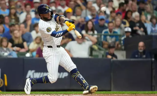 Milwaukee Brewers' Jackson Chourio hits a solo home run during the first inning of a baseball game against the Texas Rangers, Saturday, Aug. 29, 2026, in Milwaukee. (AP Photo/Aaron Gash)