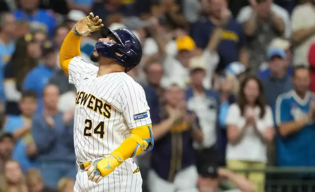 Milwaukee Brewers' William Contreras gestures as he rounds the bases after hitting a solo home run during the first inning of a baseball game against the Texas Rangers, Saturday, Aug. 29, 2026, in Milwaukee. (AP Photo/Aaron Gash)
