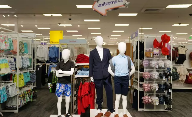 Children's clothing including uniforms are on display in a Target store, Thursday, Aug. 13, 2026, in Woodbury, Minn. (AP Photo/Ellen Schmidt)