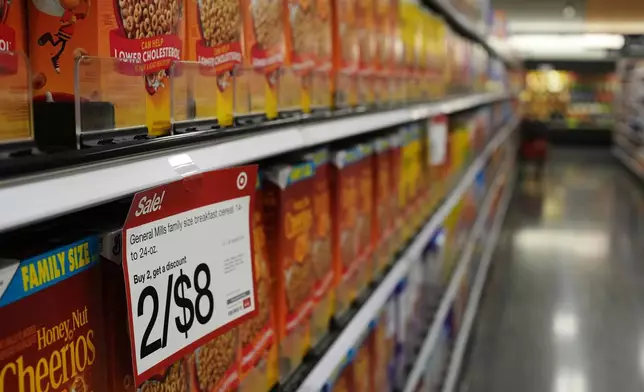 The cereal aisle is seen at a Target store, Thursday, Aug. 13, 2026, in Woodbury, Minn. (AP Photo/Ellen Schmidt)