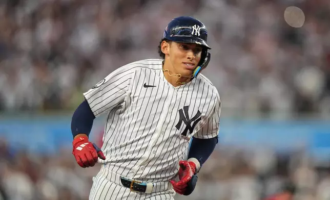 New York Yankees' George Lombard Jr. runs the bases after hitting a home run during the fifth inning of a baseball game against the St. Louis Cardinals Tuesday, Aug. 4, 2026, in New York. (AP Photo/Frank Franklin II)