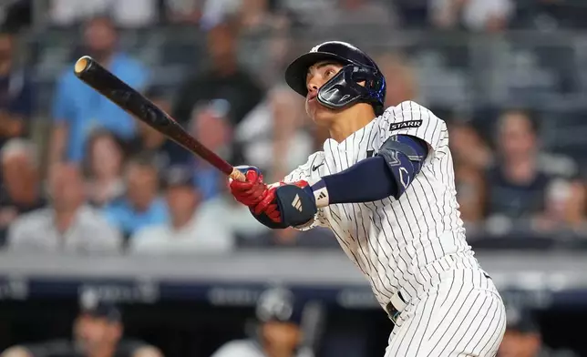 New York Yankees' George Lombard Jr. hits a home run during the fifth inning of a baseball game against the St. Louis Cardinals Tuesday, Aug. 4, 2026, in New York. (AP Photo/Frank Franklin II)