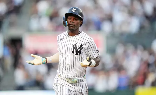 New York Yankees' Jazz Chisholm Jr. gestures as he runs the bases after hitting a home run during the second inning of a baseball game against the St. Louis Cardinals Tuesday, Aug. 4, 2026, in New York. (AP Photo/Frank Franklin II)