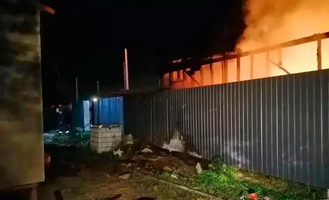 In this photo provided by Moscow Region Governor Andrei Vorobyov's official telegram channel, flame and smoke rise from a construction site after a Ukrainian drone attack in an undisclosed area in the Moscow region, Russia, Tuesday, Aug. 18, 2026. (Moscow Region Governor Andrei Vorobyov's office via AP)