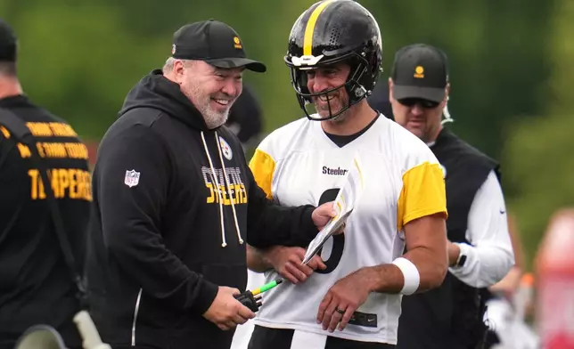 Pittsburgh Steelers quarterback Aaron Rodgers, right, shares a laugh with head coach Mike McCarthy during practice at the team's NFL football training camp in Latrobe, Pa., Wednesday, July 29, 2026. (AP Photo/Gene J. Puskar)