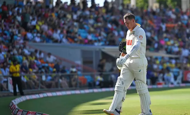 Marnus Labuschagne of Australia walks from the field after being dismissed by Taijul Islam of Bangladesh during play on day three of the first cricket test in Darwin, Australia, Saturday, Aug.15, 2026, (James Ross/AAPImage via AP)