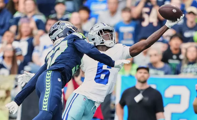 Dallas Cowboys wide receiver Camden Brown (6) catches a touchdown pass in front of Seattle Seahawks cornerback Michael Dansby in the second half of an NFL preseason football game, Saturday, Aug. 15, 2026, in Seattle. (AP Photo/Lindsey Wasson)