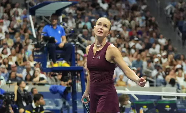 Elina Svitolina, of Ukraine, reacts after missing a shot while competing with and Gael Monfils, of France, against Belinda Bencic, of Switzerland, and Flavio Cobolli, of Italy, during a mixed doubles semifinal match at the U.S. Open tennis championships Wednesday, Aug. 26, 2026, in New York. (AP Photo/Frank Franklin II)