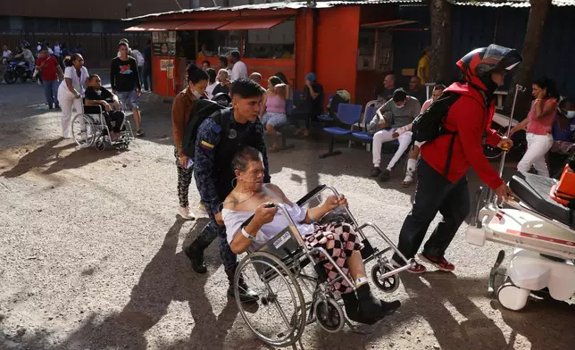 Patients are evacuated from a hospital after an earthquake struck Cali, Colombia, Monday, Aug. 10, 2026. (AP Photo/Santiago Saldarriaga)