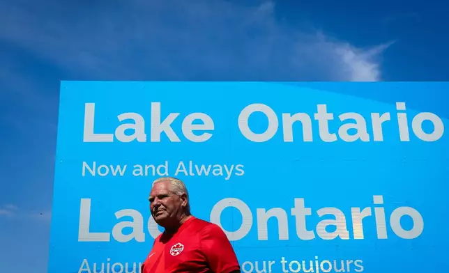 Ontario Premier Doug Ford unveils a sign for Lake Ontario at Fifty Point Conservation Area in Grimsby, Ontario, Canada, on Saturday, Aug. 29, 2026. (Keito Newman/The Canadian Press via AP)