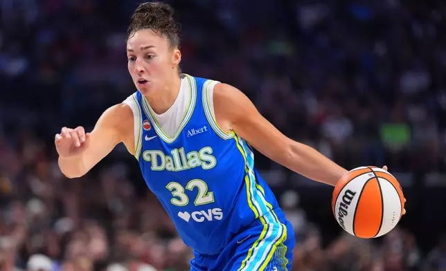 Dallas Wings forward Jessica Shepard drives with the ball during the first half of a WNBA basketball game against the Indiana Fever in Dallas, Thursday, Aug. 20, 2026. (AP Photo/LM Otero)