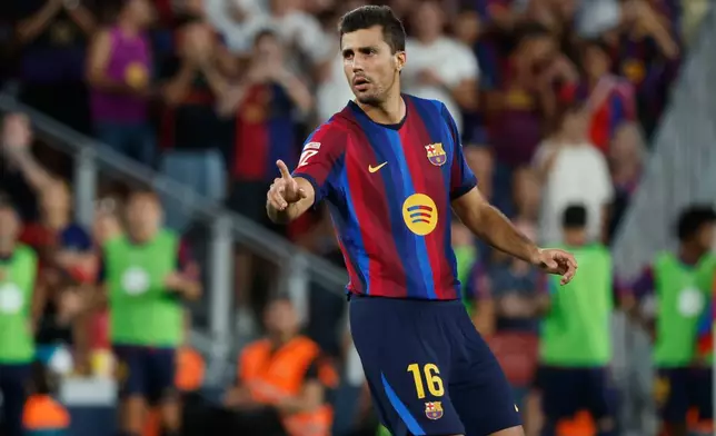 Barcelona's Rodrigo gestures during a Spanish La Liga soccer match between Barcelona and Athletic in Barcelona, Spain, Thursday, Aug. 27, 2026. (AP Photo/Joan Monfort)