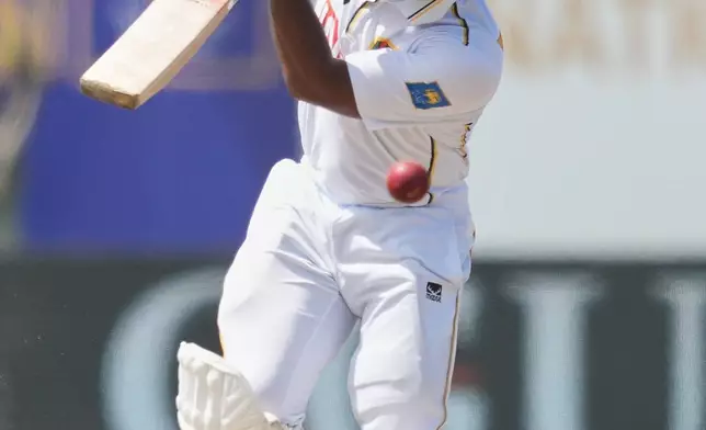 Sri Lanka's Sonal Dinusha plays a shot during the day five of the first cricket test match between Sri Lanka and India in Galle, Sri Lanka, Wednesday, Aug. 19, 2026. (AP Photo/Eranga Jayawardena)
