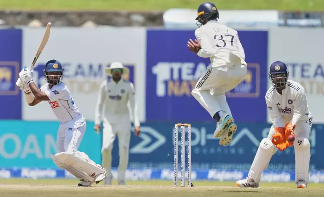 Sri Lanka's Sonal Dinusha plays a shot during the day five of the first cricket test match between Sri Lanka and India in Galle, Sri Lanka, Wednesday, Aug. 19, 2026. (AP Photo/Eranga Jayawardena)