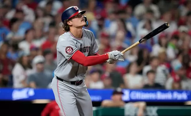 Washington Nationals' Brady House watches after hiting a home run against Philadelphia Phillies' Brooks Raley during the seventh inning of a baseball game Wednesday, Aug. 5, 2026, in Philadelphia. (AP Photo/Matt Slocum)