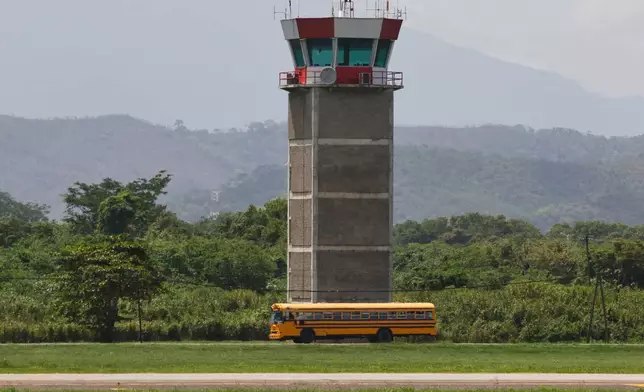 Migrants deported from the United States are transported in a bus after arriving on plane at the Ramon Villeda Morales Airport in San Pedro Sula, Honduras, Thursday, Aug. 20, 2026. (AP Photo/Delmer Martinez)