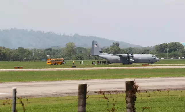 Migrants deported from the United States walk to a waiting bus after deplaning at the Ramon Villeda Morales Airport in San Pedro Sula, Honduras, Thursday, Aug. 20, 2026. (AP Photo/Delmer Martinez)
