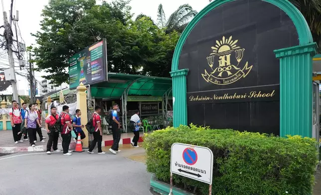 Students arrive at Debsirin Nonthaburi School, a day after the shooting at the school, in Nonthaburi province, Thailand Saturday, Aug. 8, 2026. (AP Photo/Sakchai Lalit)