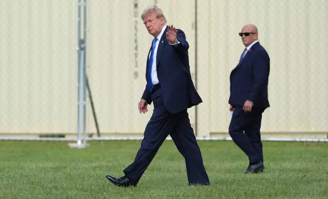 President Donald Trump walks to board his presidential limousine after arriving on Marine One from the Ellipse near the White House, Friday, Aug. 28, 2026, in Washington, on return from Houston. (AP Photo/Jacquelyn Martin)